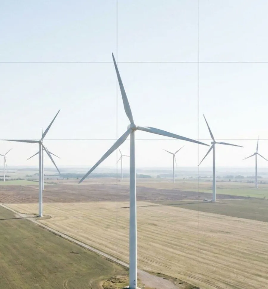 Aerial view of wind turbines over open land